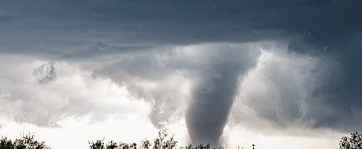 A huge dark cloud with a swirling funnel in southwest Texas