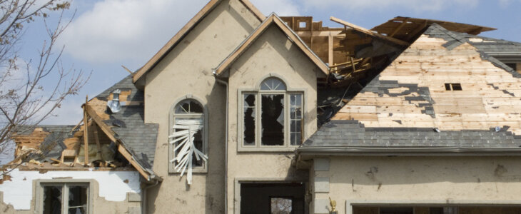 Roof damage on a house after a storm